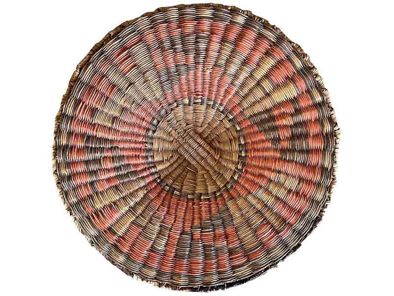 Hopi – third mesa – Antique Hopi wicker tray (earlier 1900s) with traditional Hopi design in faded purple and yellow vegetal dyes on red ground.