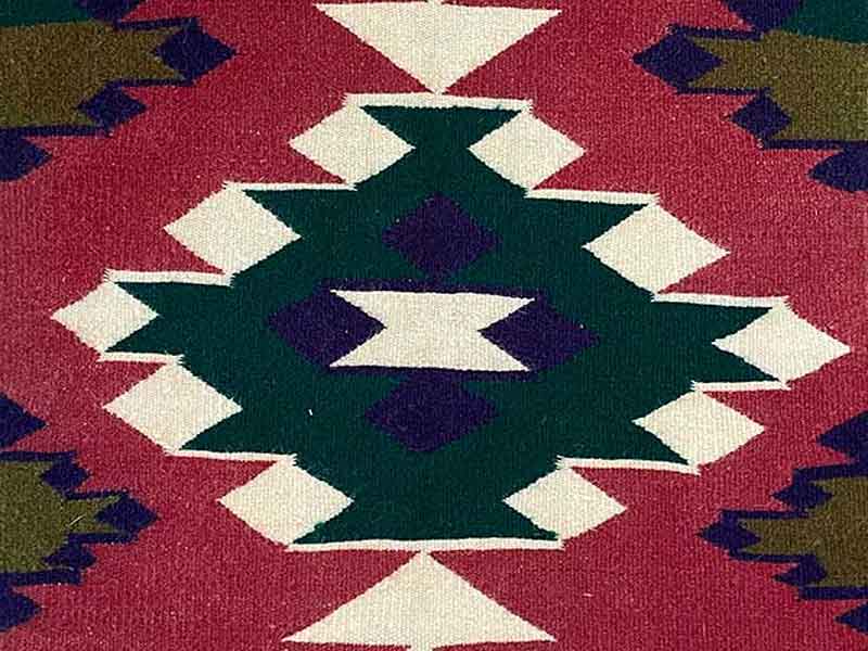 Germantown sampler rug. White, blue, green center; sienna brown background with 4 green and blue side elements