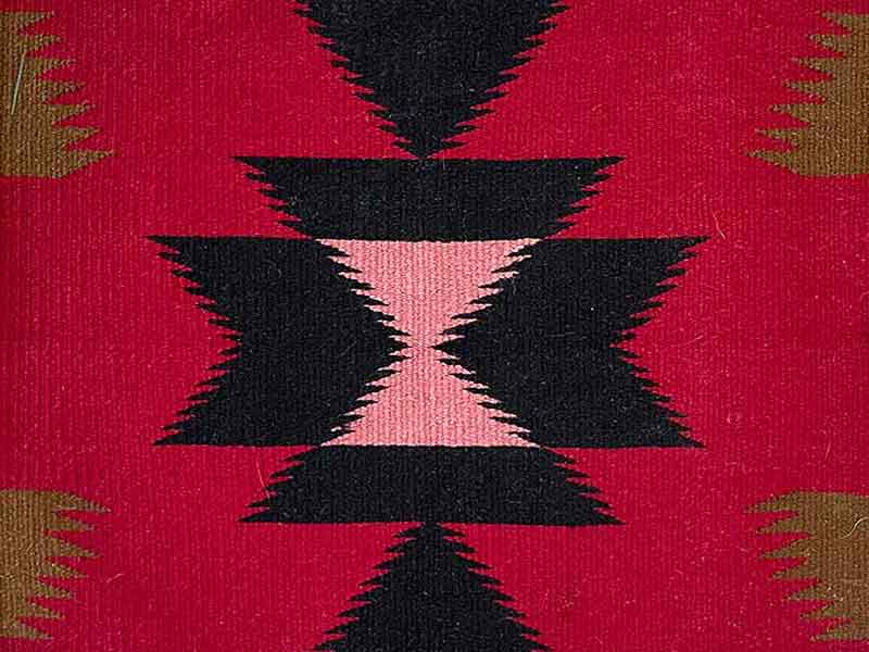 Germantown sampler rug. Pink center diamonds on black; red background with 4 light brown side elements