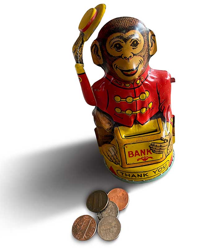 Monkey tipping his hat toy bank